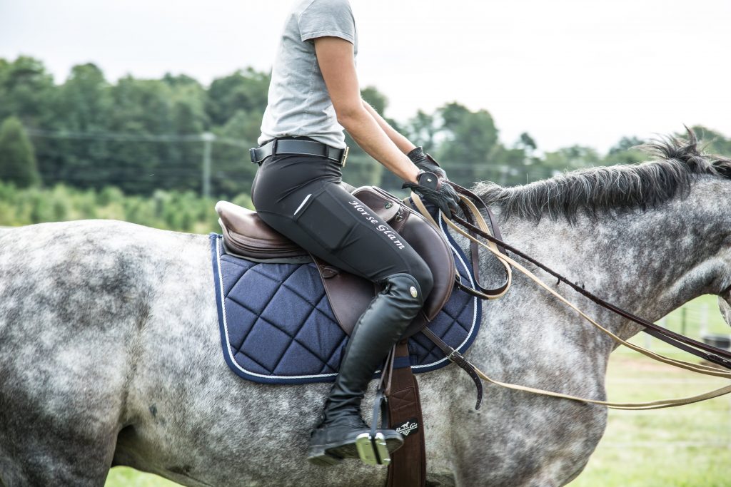 women riding horse